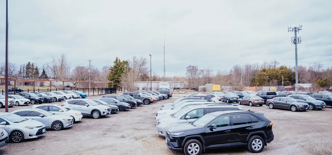 Rows of cars in the free parking lot at Kingdom Stars Assembly, 687 Eramosa Road, Guelph, on a Sunday morning